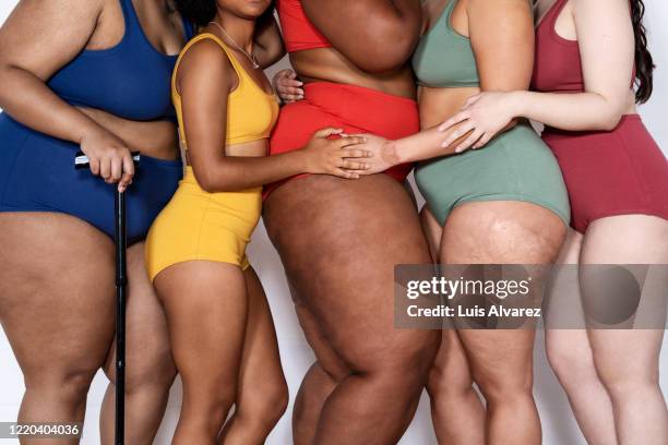 women with different body type together in lingerie - body positive stockfoto's en -beelden