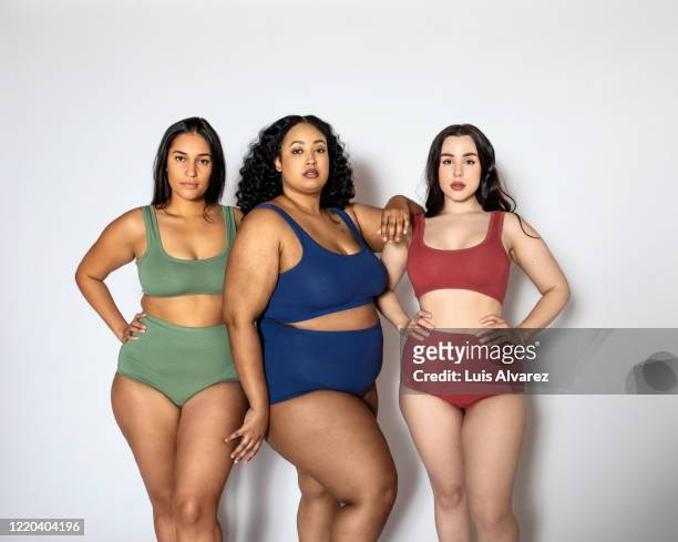 group of women with different body shapes in lingerie - cellulite stock-fotos und bilder
