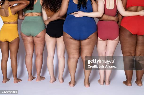 rear view of a diverse females together in underwear - statur stock-fotos und bilder