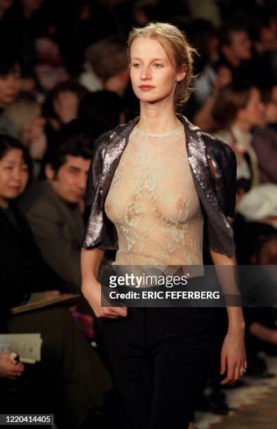 Model presents a short metallic-coloured jacket over a lacy camisole for British designer Stella McCartney's label, Chloe, during the 1999-2000...