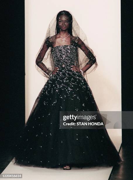 Model wears a black wedding dress with a veil during the Oscar de la Renta fashion show 03 November in New York. The show is part of the Fashion Week...