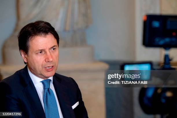 Italy's Prime Minister Giuseppe Conte speaks during an interview with AFP at Villa Pamphilj in Rome on June 16 as the country eases its lockdown...