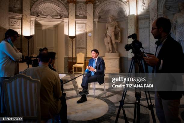 Italy's Prime Minister Giuseppe Conte speaks during an interview with AFP at Villa Pamphilj in Rome on June 16 as the country eases its lockdown...