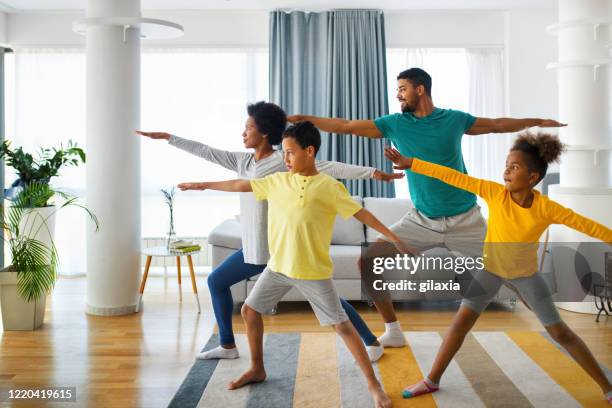 family exercising at home - healthy routine stock pictures, royalty-free photos & images