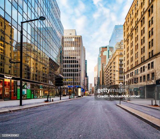 montreal boulevard de maisonneuve at sunset on an april cloudy day - montreal downtown stock pictures, royalty-free photos & images