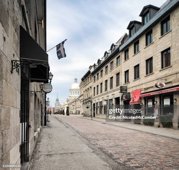 empty old montreal street scene on a cloudy springtime day - vieux montréal stock pictures, royalty-free photos & images