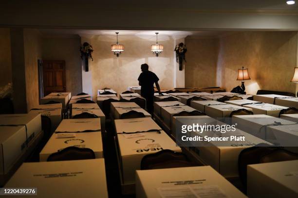 Omar Rodriguez organizes bodies in the Gerard Neufeld funeral home on April 22, 2020 in the Elmhurst neighborhood of the Queens borough in New York...