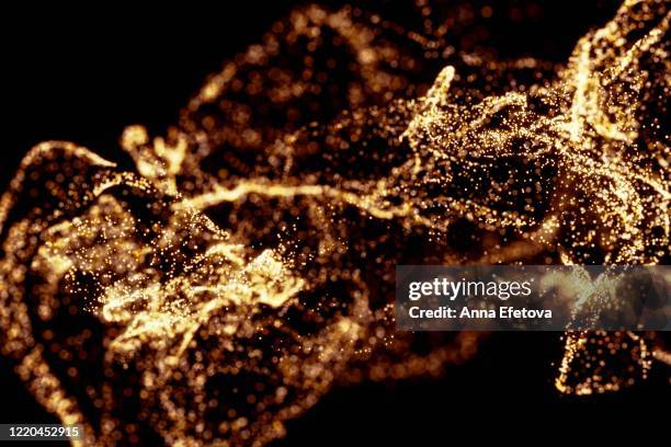 splash of particles on black background - black powder stock pictures, royalty-free photos & images