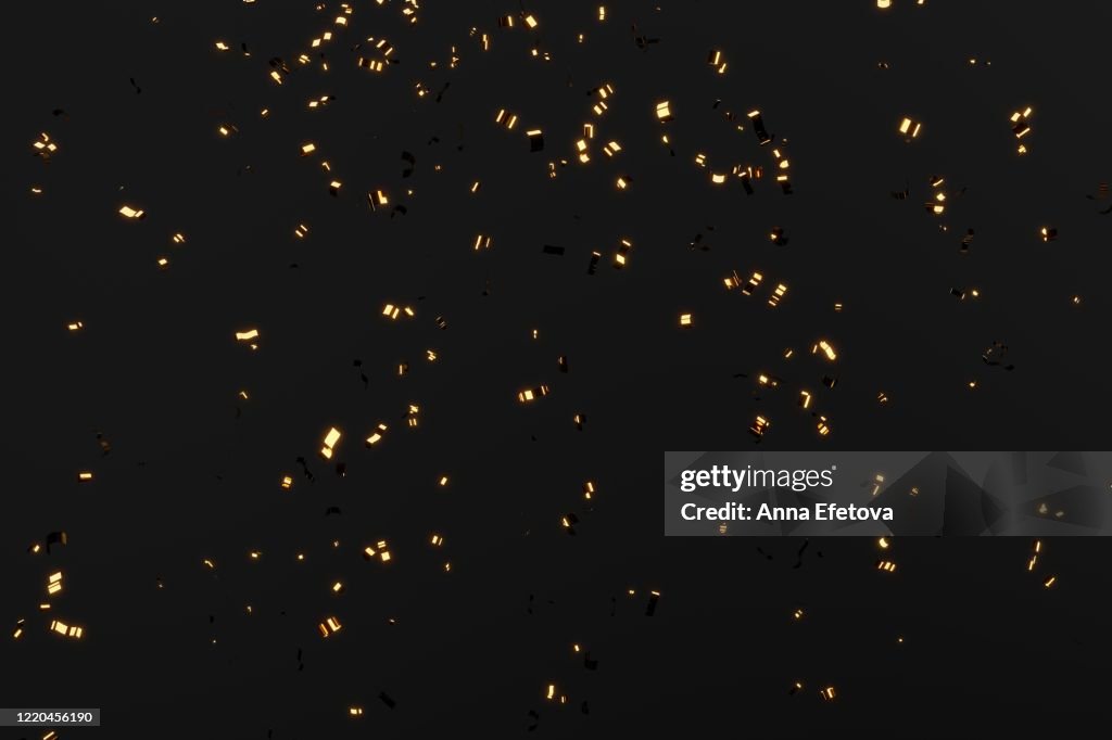 Falling golden glowing confetti