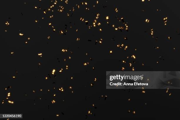 falling golden glowing confetti - confetti gold stock pictures, royalty-free photos & images