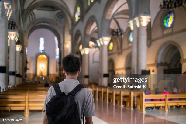 teenage boy visiting church - golden boy stock pictures, royalty-free photos & images