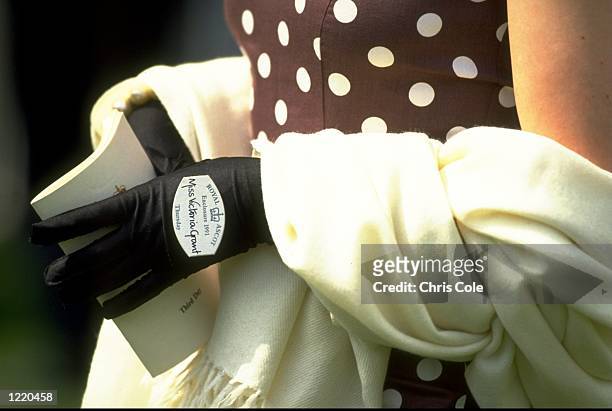 Miss Victoria Grant holding a programme in the Royal Enclosure during Ladies Day at Royal Ascot in Berkshire, England. \ Mandatory Credit: Chris...