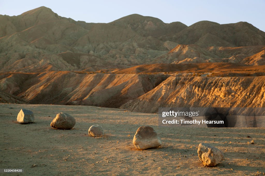 Late afternoon light on small boulders and mountains beyond in Anza Borrego Desert State Park