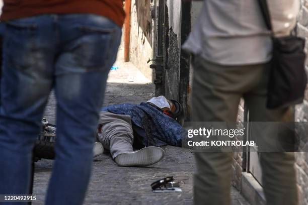 The lifeless body of Raffaele Gallo at the crime scene where he, on his scooter, was killed by some killers in a Camorra ambush in San Giorgio a...