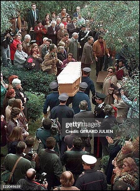 Marcello Mastroianni's coffin is carried inside the Verano cemetary of Rome 22 December where the Italian actor will be buried beside his mother....