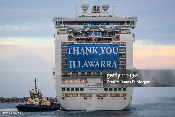 Thank You Illawarra" banner hangs from the stern of the Ruby Princess as she departs Port Kembla on April 23, 2020 in Wollongong, Australia....