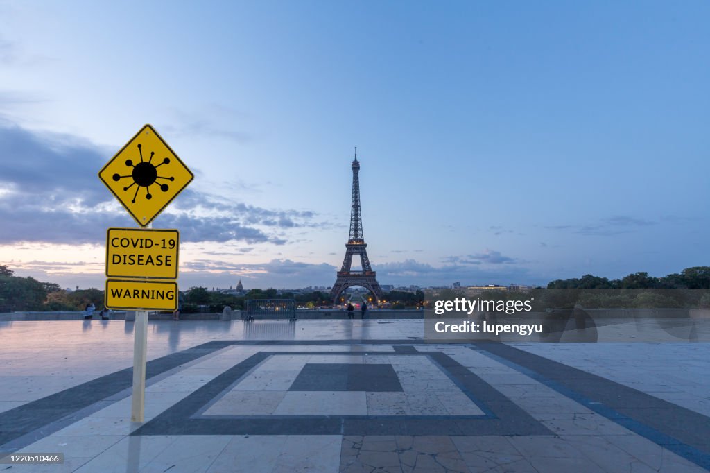 Covid-19 warning sign with Eiffel tower,Paris