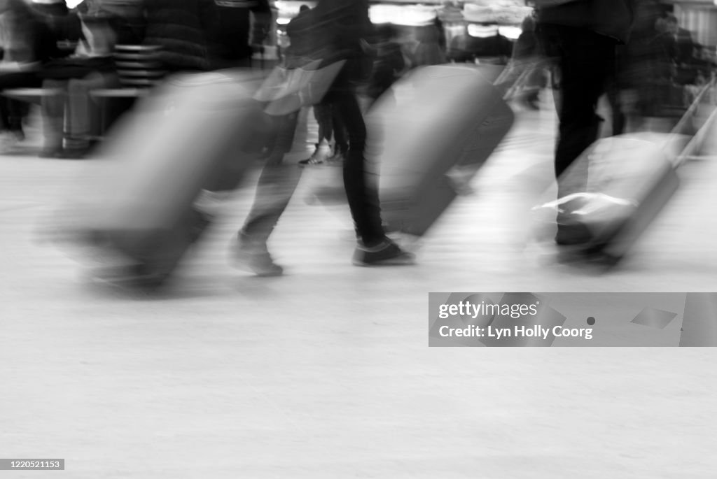 Blurred movement of Travellers with luggage