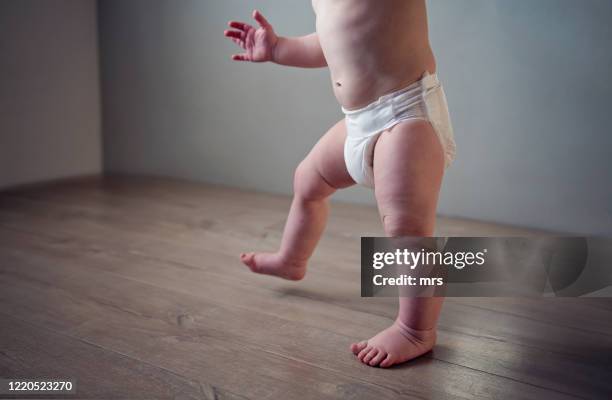 first steps - baby standing stock pictures, royalty-free photos & images