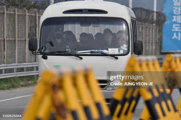 Bus carrying South Korean soldiers drives past barricades at a checkpoint on the Tongil bridge, the road leading to North Korea's Kaesong joint...