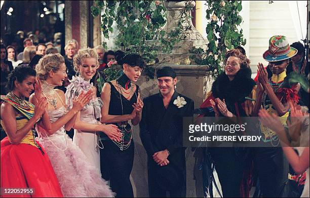 British designer John Galliano is applauded by his models 20 January 1997 in Paris after the presentation of Christian Dior's spring/summer Haute...
