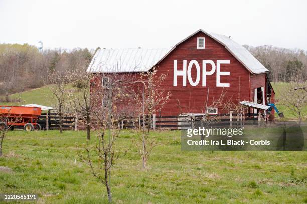 Red barn with a large white sign on it saying , "HOPE" expressing what many American are looking toward. On April 15, New York Governor Andrew Cuomo...