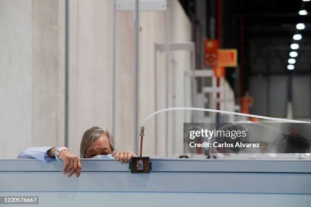 Coronavirus patient is seen at the COVID-19 IFEMA Hospital on April 23, 2020 in Madrid, Spain. Starting last week, some businesses deemed...