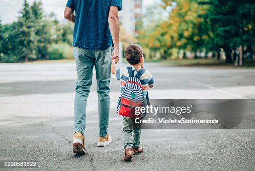 Father and son going to kindergarten. Father and son going to kindergarten.