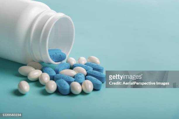 pills on color background - generic drug stock pictures, royalty-free photos & images