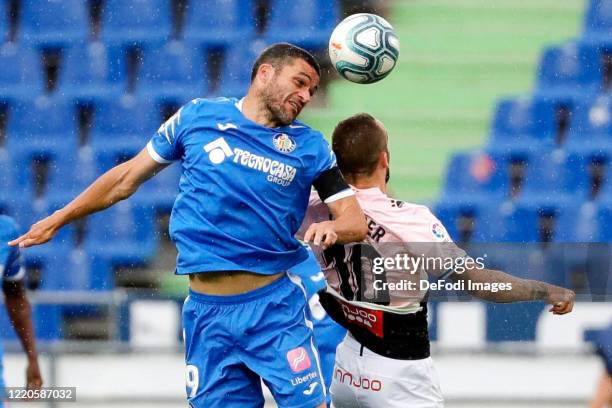 Jorge Molina of FC Getafe and Sergi Darder of Espanyol Barcelona battle for the ball during the Liga match between Getafe CF and RCD Espanyol at...
