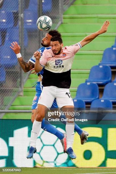 Erick Cabaco of FC Getafe and Jonathan Calleri of Espanyol Barcelona battle for the ball during the Liga match between Getafe CF and RCD Espanyol at...