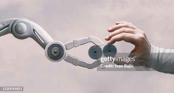 ギヤを使ったロボットと人間の手 ギヤを使ったロボットと人間の手