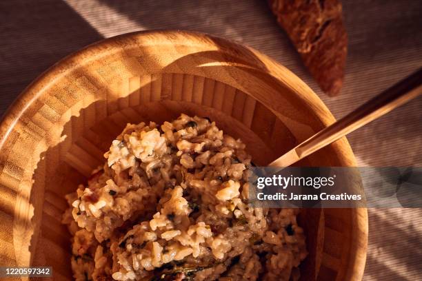 bowl of risotto ready to eat - brown rice stock pictures, royalty-free photos & images
