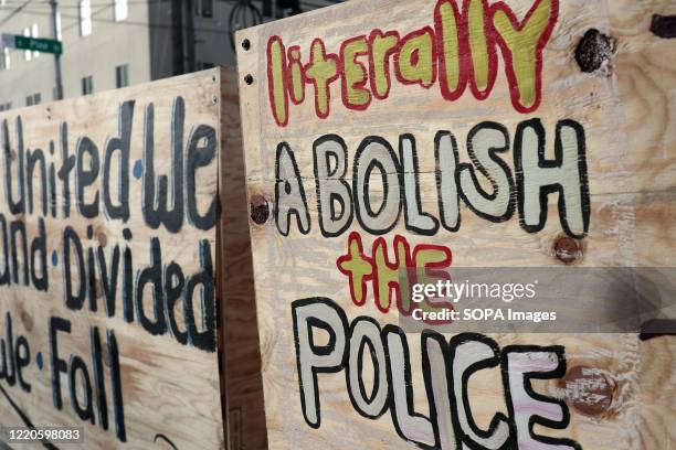 Graffiti on a barricade inside the so-called "Capitol Hill Autonomous Zone" call for the abolition of police. The area surrounding Seattle's East...