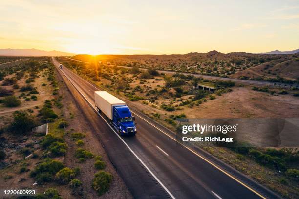 long haul semi truck on a rural western usa interstate highway - truck front view stock pictures, royalty-free photos & images