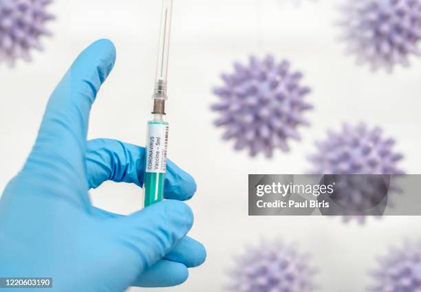 doctor holding coronavirus vaccine. covid 19 concept - viral infection stock pictures, royalty-free photos & images