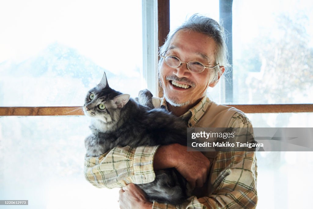 Japanese senior man and his pet cat