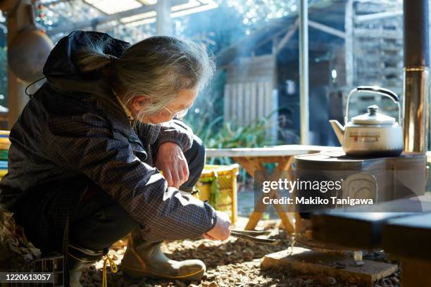 japanese senior farmer with kettle on his farm - やかん　日本 ストックフォトと画像