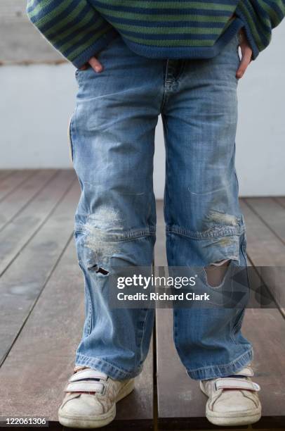 childrens ripped jeans - boy jeans stock pictures, royalty-free photos & images