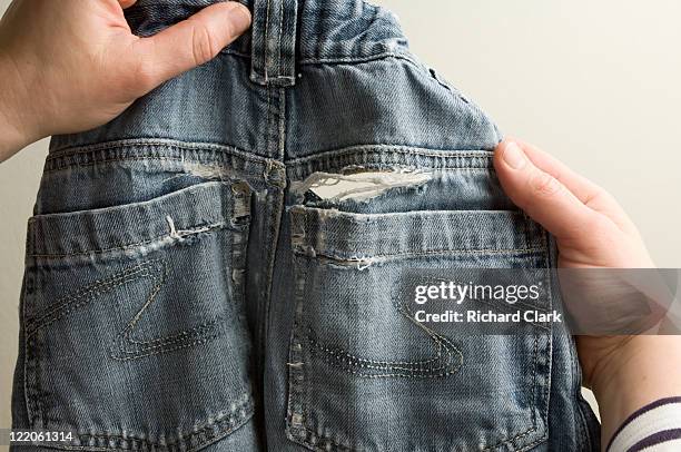 childrens ripped jeans - pants stock pictures, royalty-free photos & images