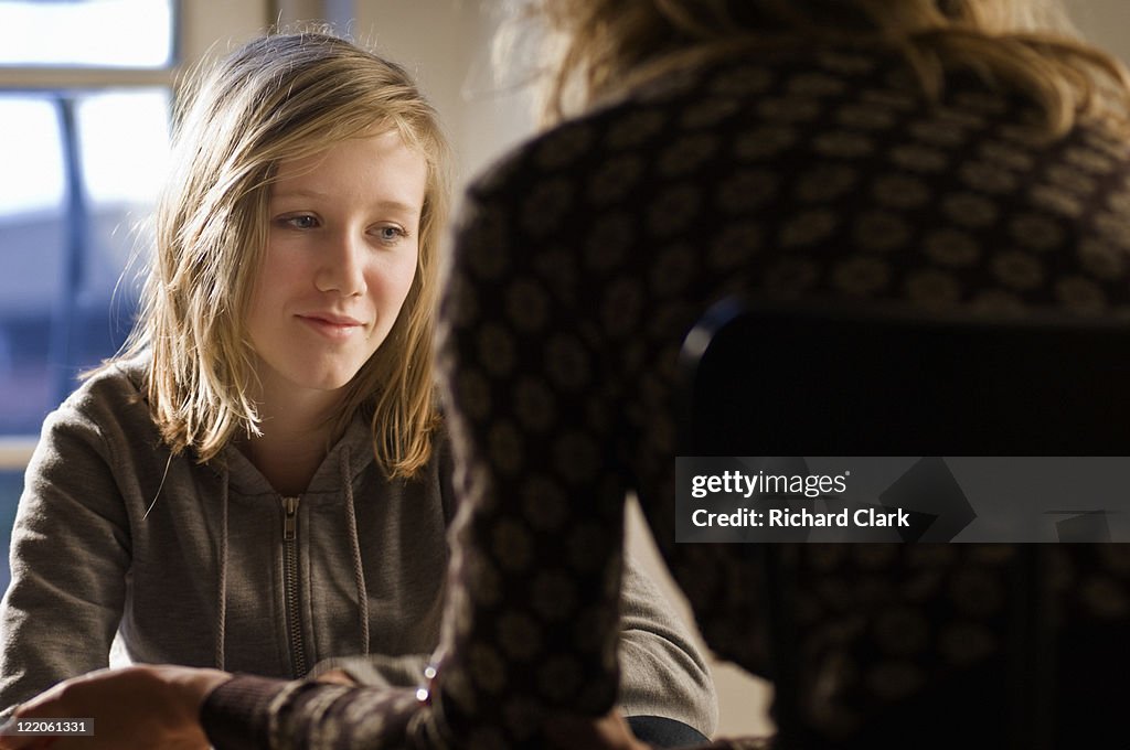 Girl talking to a counselor