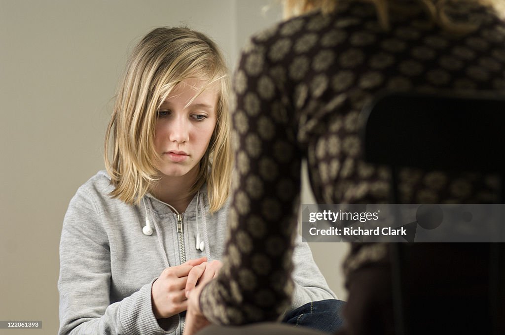 Girl talking to a counselor