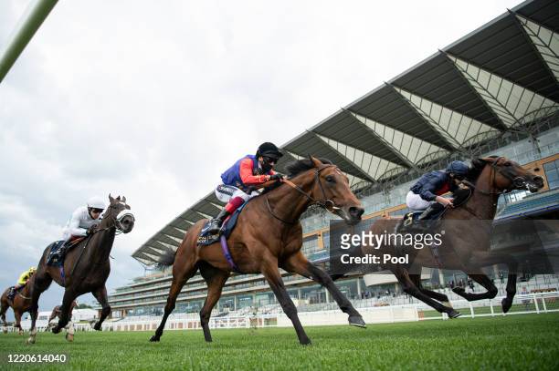 Russian Emperor ridden by Ryan Moore beats The Queen's horse, First Receiver ridden by Frankie Dettori in the Hampton Court Stakes during Day 2 of...