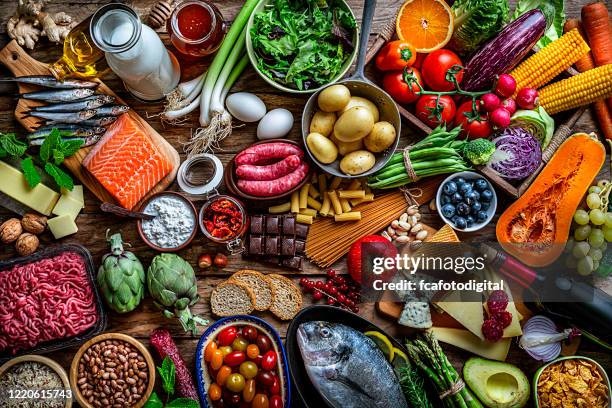 food backgrounds: table filled with large variety of food shot from above - flat lay food stock pictures, royalty-free photos & images