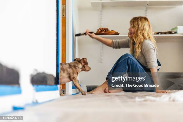 woman working on diy project at home - protective sheet stock pictures, royalty-free photos & images