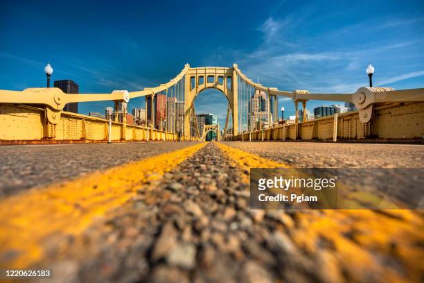 downtown skyline and the roberto clemente bridge in pittsburgh pennsylvania usa - pittsburgh stock pictures, royalty-free photos & images