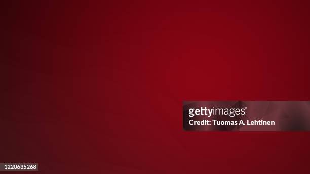 wavy and delicate lines on red background. - rosso foto e immagini stock