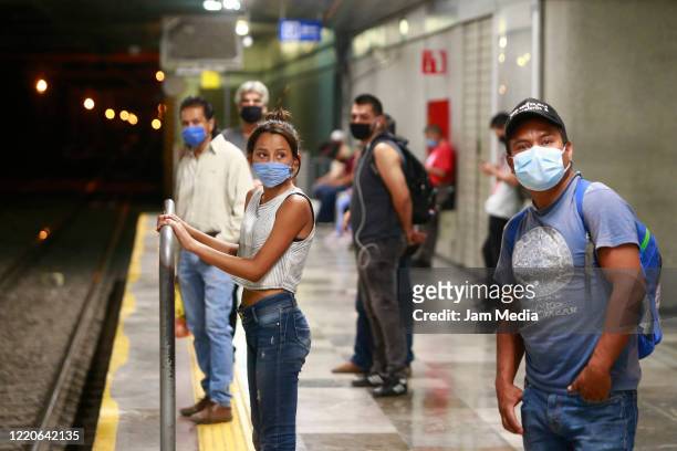 Commuters wear protective masks while waiting a subway train on April 23, 2020 in Guadalajara, Mexico. Mexico started what the authorities call Stage...