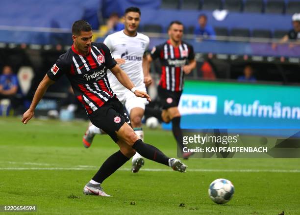 Frankfurt's Portuguese forward Andre Silva scores the opening goal during the German first division Bundesliga football match Eintracht Frankfurt v...