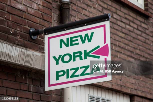 Pizza Store Sign Photos and Premium High Res Pictures - Getty Images